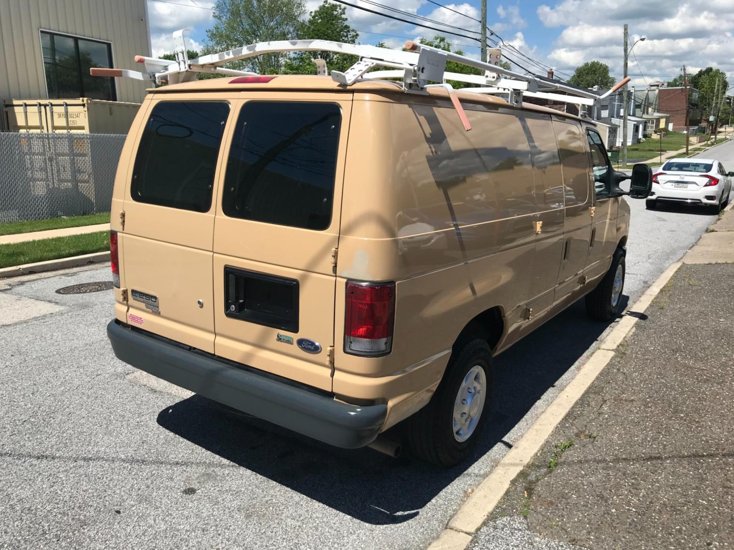 2011 Tan /Gray Ford E-Series Van E250 (1FTNE2EW5BD) with an 4.8 V8 engine, Automatic transmission, located at 577 Chester Pike, Prospect Park, PA, 19076, (610) 237-1015, 39.886154, -75.302338 - 2011 Ford E250 Cargo Van: Ladder racks, shelving, heavy duty partition, power inverter, fully metal body, FLEET MAINTAINED, runs LIKE NEW! This vehicle comes inspected and has been given a bumper to bumper safety check. It is very clean, reliable, and well maintained. We offer a unique pay plan t - Photo#4